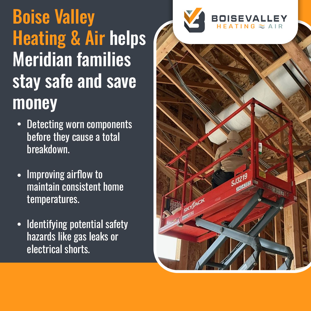 HVAC technician on lift installing ceiling duct system for home heating in Meridian Idaho